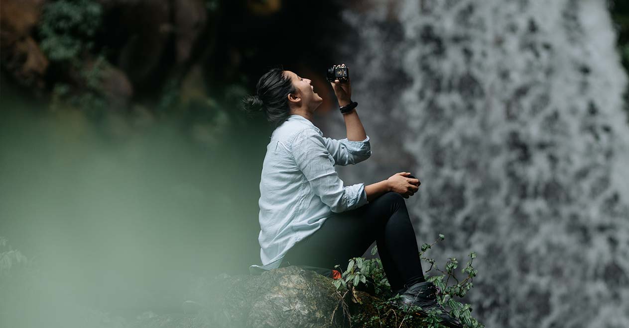 Eating Mad Honey beside a waterfall